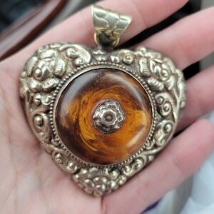 Amber Pendant in Tibetan Repousse Silverwork